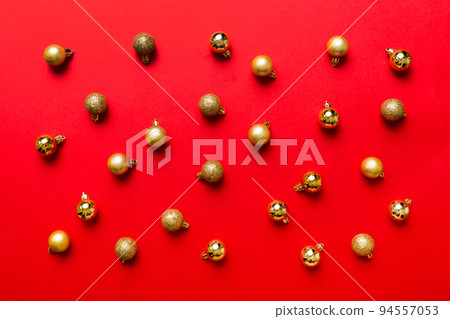 Christmas composition. a pattern of christmas balls on colored background. Flat lay, top view New year decor Christmas composition. a pattern of christmas balls on colored background. Flat lay, top view New year decor 94557053