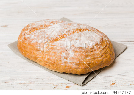 Fresh homemade crisp bread on napkin, top view. Healthy unleavened bread. French bread. Top view Bakery products Fresh homemade crisp bread on napkin, top view. Healthy unleavened bread. French bread. Top view Bakery products 94557187