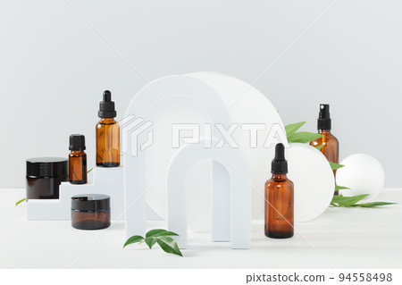 Various blank cosmetic container mock-ups on podiums and geometrical forms. Background for branding and packaging presentation 94558498