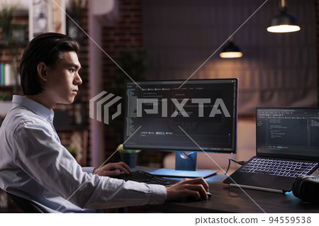Asian engineer developing app software on computer, working with binary code program to create firewall security server. Programming application code with cloud computing on high tech interface. Asian engineer developing app software on computer, working with binary code program to create firewall security server. Programming application code with cloud computing on high tech interface. 94559538