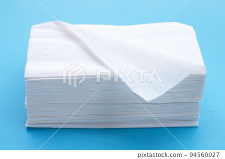 Facial tissue on blue background. Facial tissue on blue background. 94560027