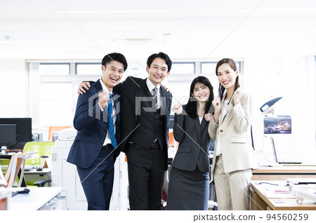 Business office group photo looking at the camera 4 men and women smiling 94560259