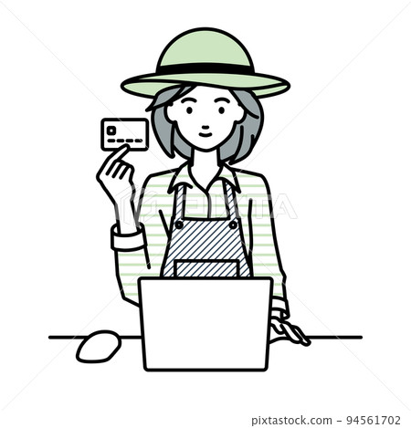 一位農婦坐在辦公桌前,拿著信用卡使用電腦 一位農婦坐在辦公桌前,拿著信用卡使用電腦 94561702