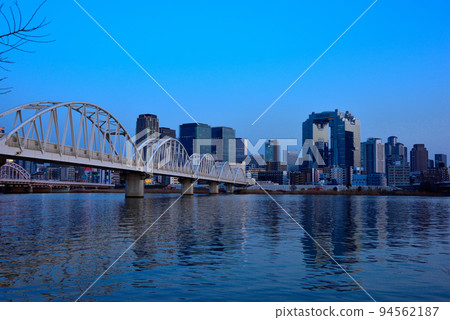 Evening view of Umeda from the Yodogawa riverbed in Osaka 94562187