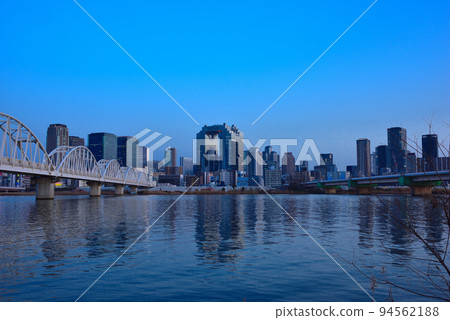 Evening view of Umeda from the Yodogawa riverbed in Osaka 94562188