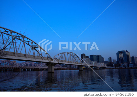 Evening view of Umeda from the Yodogawa riverbed in Osaka 94562190