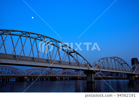 Evening view of Umeda from the Yodogawa riverbed in Osaka 94562191