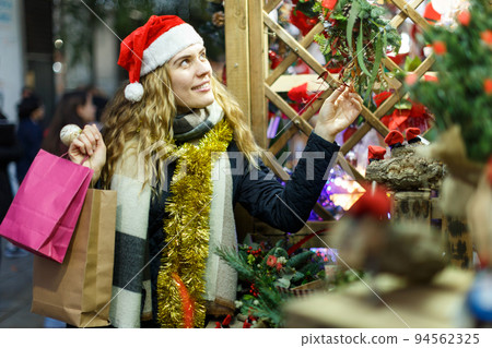 Cheerful girl at Christmas fair Cheerful girl at Christmas fair 94562325
