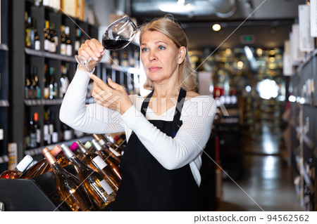 Ordinary woman sommelier tasting natural wines Ordinary woman sommelier tasting natural wines 94562562