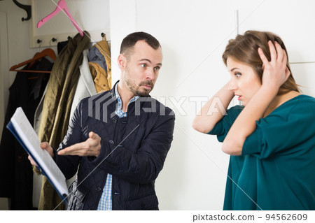 Angry householder visiting upset girl Angry householder visiting upset girl 94562609