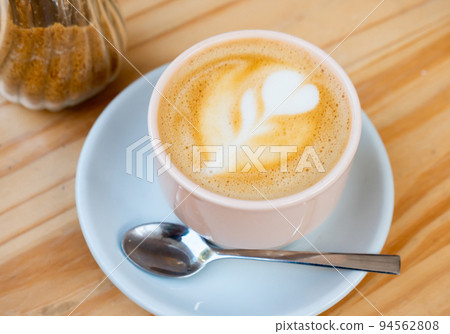 Image of cup of fresh coffee cortado on table 94562808