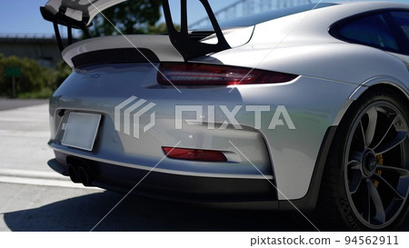 Rear view of the silver Porsche 911 GT3RS standing in the parking lot Rear view of the silver Porsche 911 GT3RS standing in the parking lot 94562911