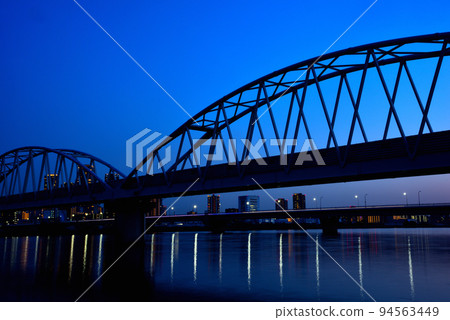 Evening view of Umeda from the Yodogawa riverbed in Osaka 94563449