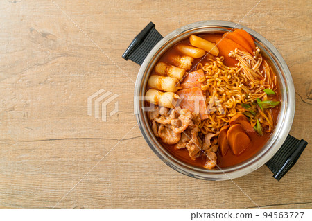 Budae Jjigae or Budaejjigae (Army stew or Army base stew). It is loaded with Kimchi, spam, sausages, ramen noodles and much more Budae Jjigae or Budaejjigae (Army stew or Army base stew). It is loaded with Kimchi, spam, sausages, ramen noodles and much more 94563727