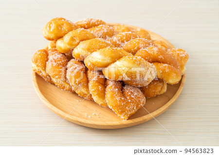 sugar doughnut in spiral shape sugar doughnut in spiral shape 94563823