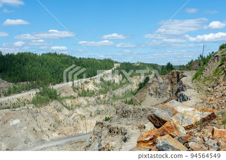 The production of graphite. Deep quarry for the extraction of minerals. The production of graphite. Deep quarry for the extraction of minerals. 94564549