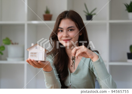 Real estate or broker residential or Agent showing key for house and car rent. Real estate or broker residential or Agent showing key for house and car rent. 94565755