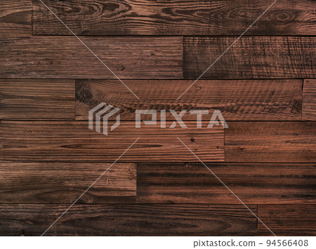 Horizontal background image of an old plank wall made of dark brown wood with coarse grain 94566408