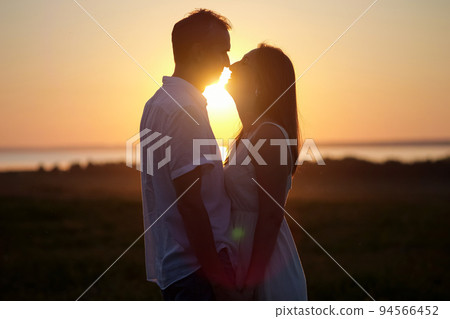 Husband expresses true love to gorgeous lover at back sunset 94566452
