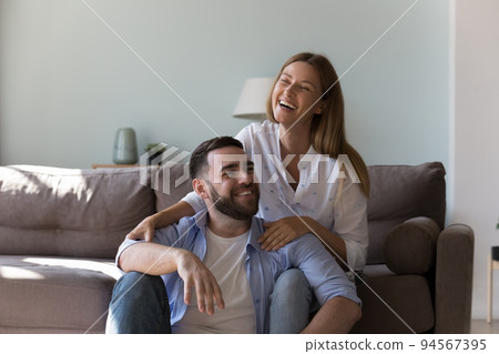 Happy attractive couple enjoying leisure time at home, Happy attractive couple enjoying leisure time at home, 94567395