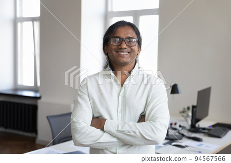 Happy confident Indian business man in glasses head shot portrait 94567566