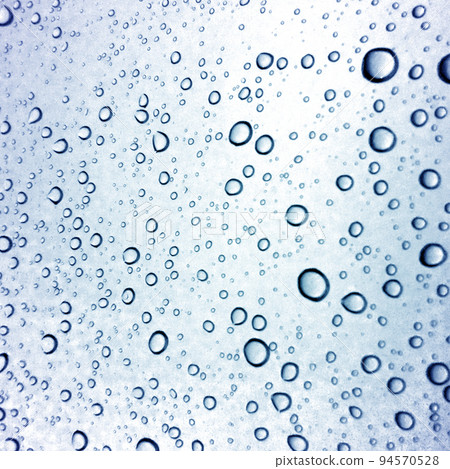 Water droplets texture on blue background 94570528
