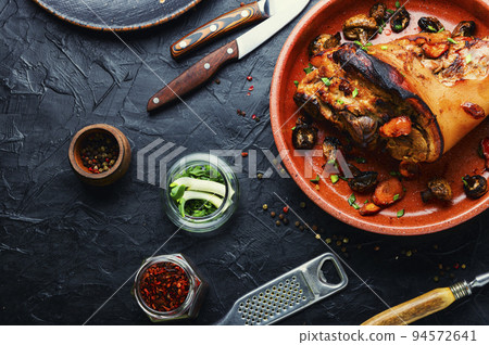 Appetizing baked pork leg 94572641