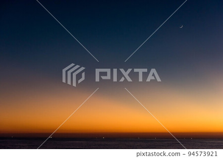 Sunset on the Sea of Japan with the moon floating Sunset on the Sea of Japan with the moon floating 94573921