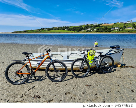Concept of enjoying the outdoors by bicycle and boat at Gweebarra Bay , County Donegal - Ireland Concept of enjoying the outdoors by bicycle and boat at Gweebarra Bay , County Donegal - Ireland 94574658