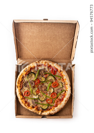 Vegetarian pizza with zucchini, tomato, peppers and mushrooms in to packaged isolated on white background 94576773