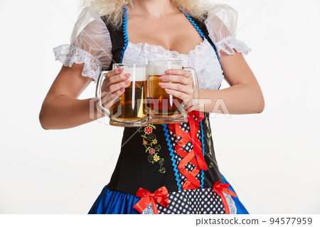 Beautiful young blond girl of oktoberfest beer stein Beautiful young blond girl of oktoberfest beer stein 94577959