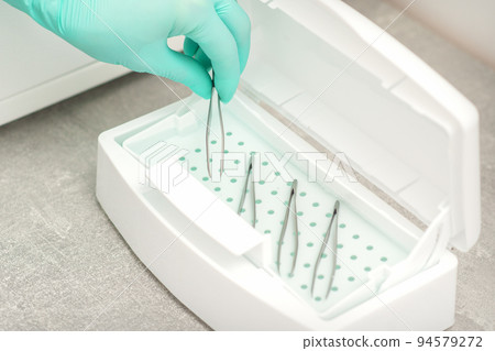 Hand disinfects tweezers with cleaning systems for medical instruments. Ultrasonic cleaner Hand disinfects tweezers with cleaning systems for medical instruments. Ultrasonic cleaner 94579272