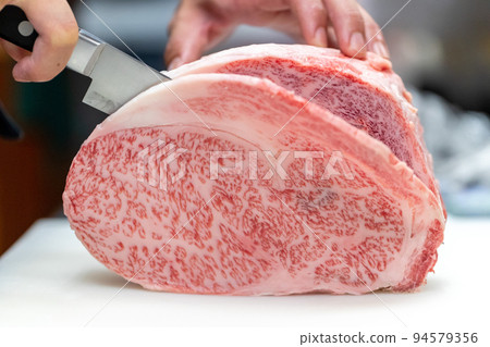 Cut beef block meat on cutting board 94579356