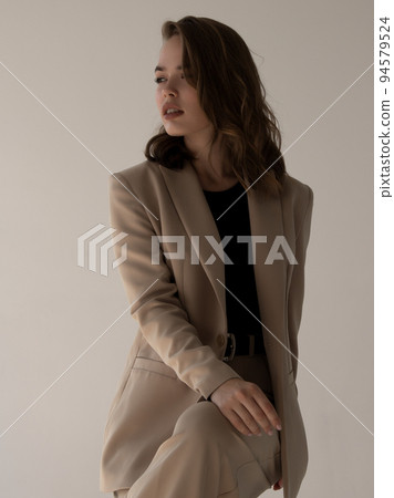 A fashionable young girl. A female model, a studio A fashionable young girl. A female model, a studio 94579524