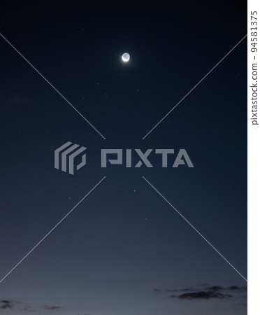 Moon and stars shiny in blue sky at night Moon and stars shiny in blue sky at night 94581375