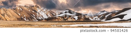 Volcanic mountain range with snow covered in Icelandic highlands on Landmannalaugar at Iceland Volcanic mountain range with snow covered in Icelandic highlands on Landmannalaugar at Iceland 94581426