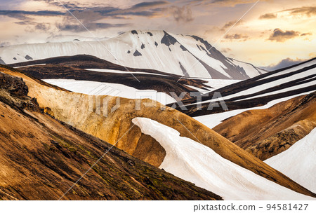 Volcanic mountain with snow covered in Fjallabak nature reserve on Icelandic highlands at Landmannalaugar, Iceland 94581427