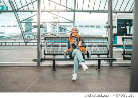 Senior woman buys the train ticket with mobile smartphone app 94583185