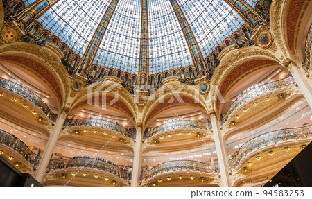 Beautiful dome in Galeries Lafayette in Paris, France. Art nouveau or Art deco style stained glass 94583253