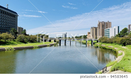 Otogawa River and Tonobashi Bridge against the clear blue sky of autumn [From Akenai Bridge/Okazaki City, Aichi Prefecture] 94583645