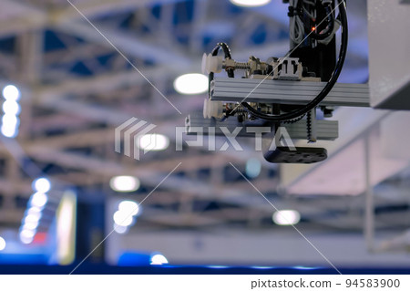 Automatic robotic arm manipulator with suction cups at plant - close up Automatic robotic arm manipulator with suction cups at plant - close up 94583900