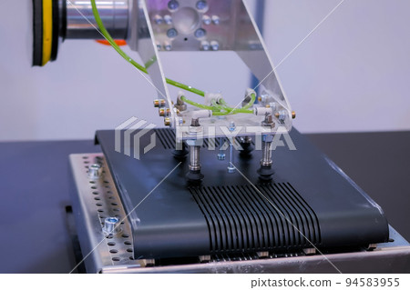 Automated robotic arm moves and places objects at trade show, exhibition Automated robotic arm moves and places objects at trade show, exhibition 94583955