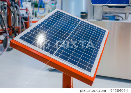 Automatic photovoltaic solar panel working at modern technology exhibition 94584054