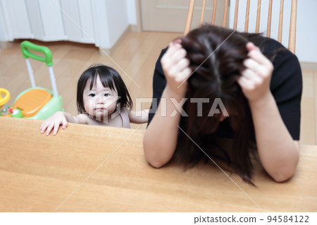 Women and children holding their heads Women and children holding their heads 94584122