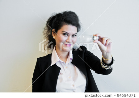 Business woman hold light bulb on white background 94584371