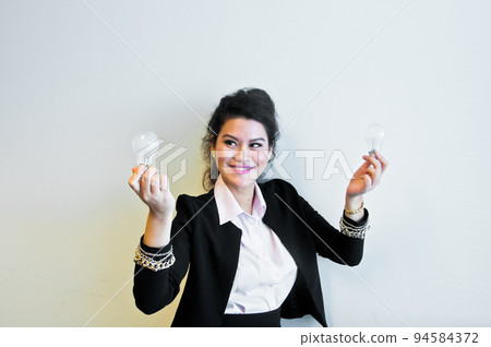 Business woman hold light bulb on white background 94584372