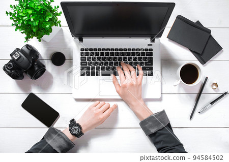Overhead view of businesswoman working at computer in office 94584502