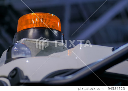 Close up of warning orange beacon flashing 94584523