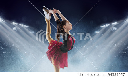 Little girl, figure skater wearing beautiful dress performing short program over ice arena background. Dance, winter sports, achievements, champion concept 94584657