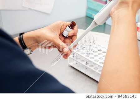 Scientist preparing samples for flow cytometric analysis using a CD38 monoclonal antibody. Scientist preparing samples for flow cytometric analysis using a CD38 monoclonal antibody. 94585143
